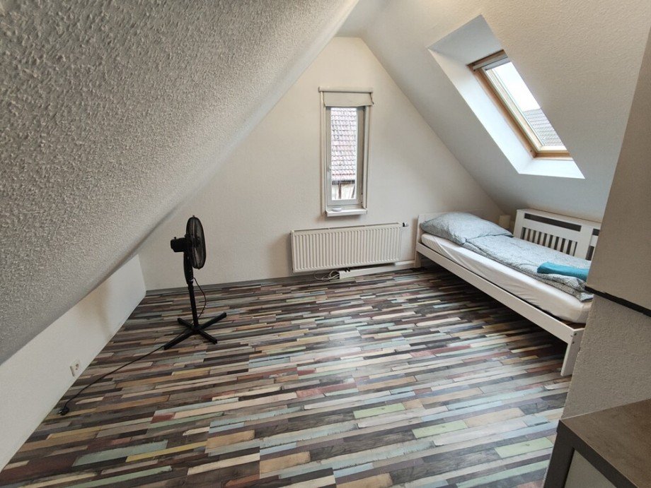 Kinderzimmer DG Mehrfamilienhaus Ludwigsburg / Pflugfelden